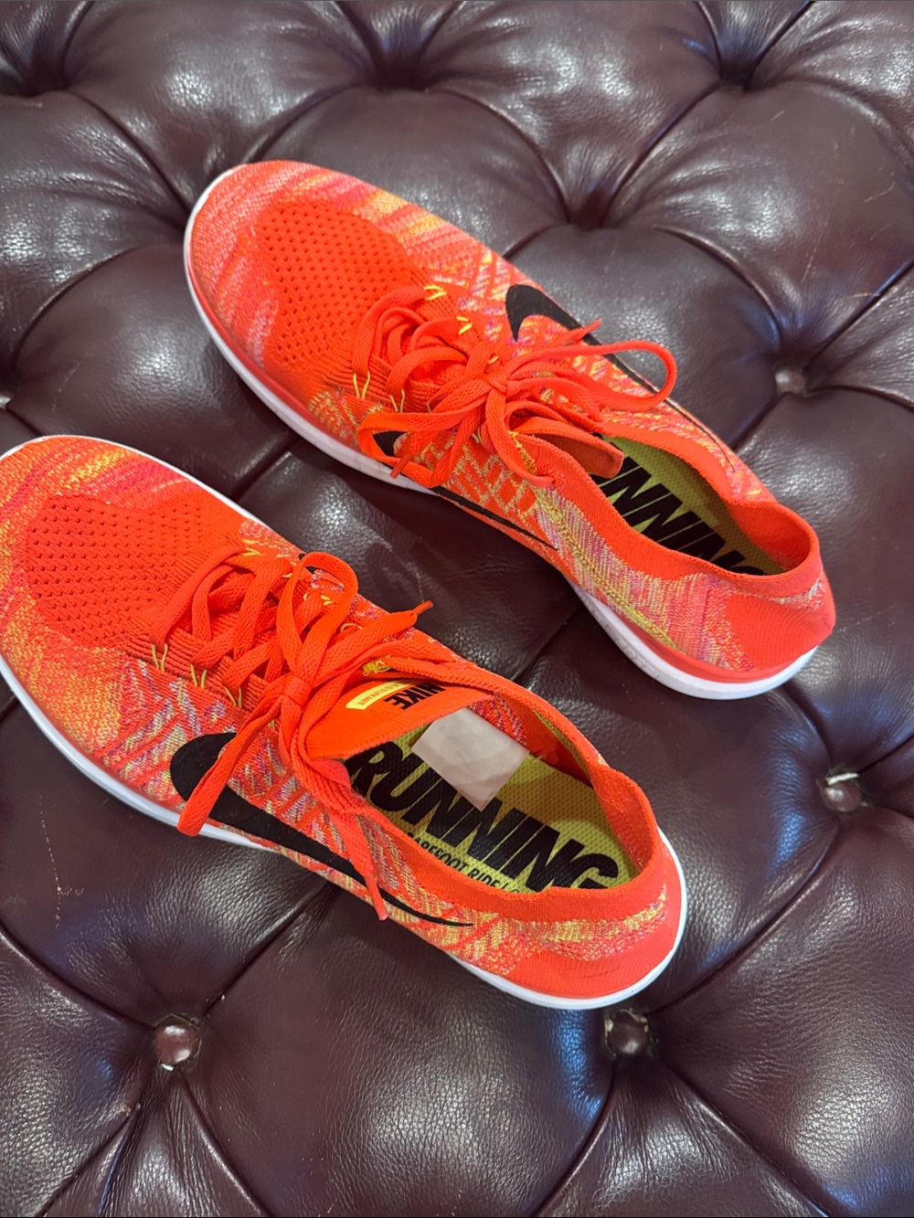 Nike Women’s Bright Orange Flyknit Running Shoes with Black Swoosh